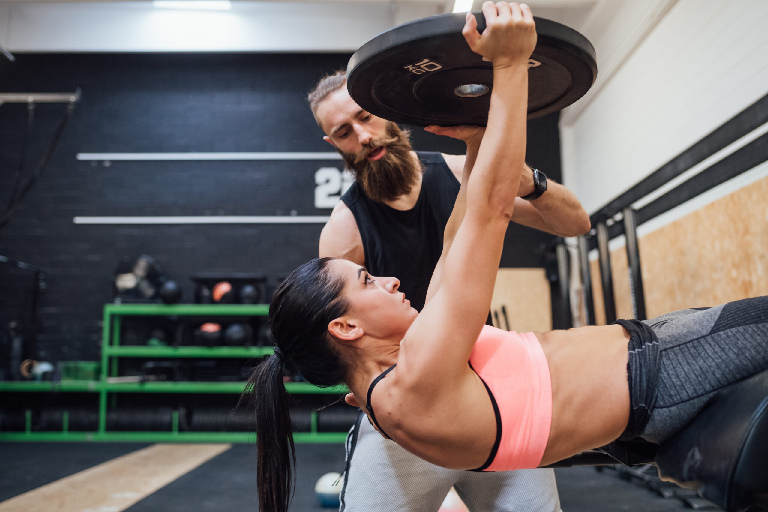 Young Man And Woman Training Toghether Indoor Gym